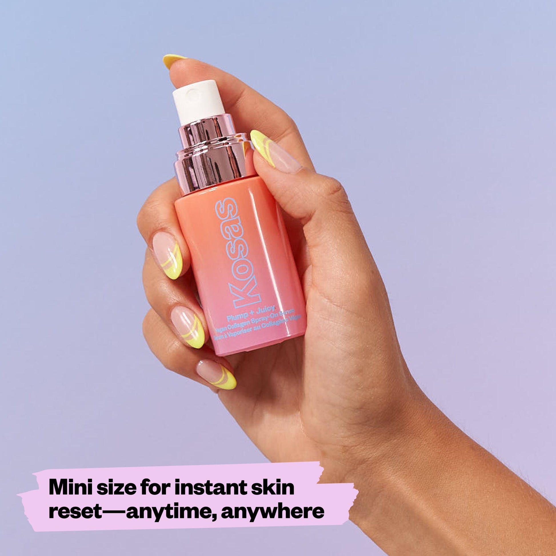 a hand holding the Mini Plump & Juicy spray